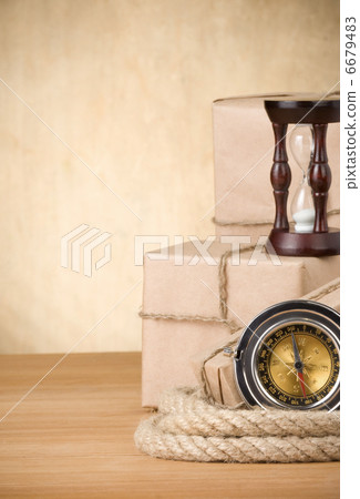 parcel wrapped box and rope on wood board parcel wrapped box and rope on wood board 6679483