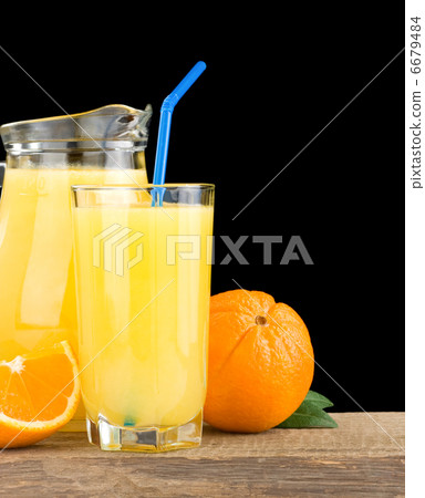 orange juice in glass and jug 6679484