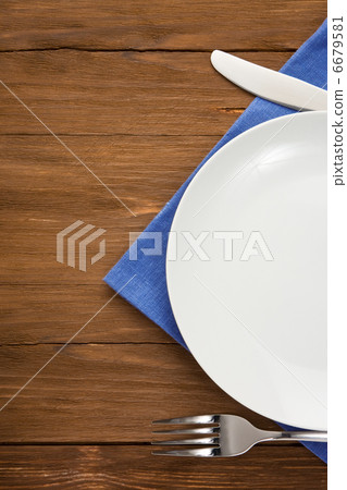 plate, knife and fork on wood plate, knife and fork on wood 6679581
