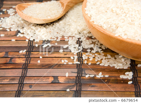 rice and wood plate with spoon rice and wood plate with spoon 6679654