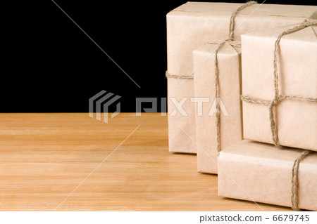 parcel wrapped packaged box isolated on black parcel wrapped packaged box isolated on black 6679745