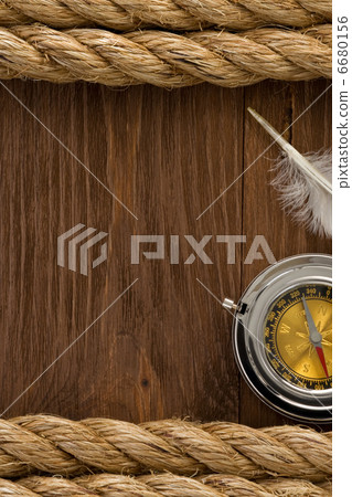 ship ropes and compass at wood 6680156