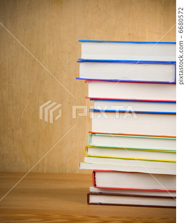pile of new books on wood 6680572