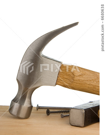 hammer and nail on wood bar isolated on white 6680638