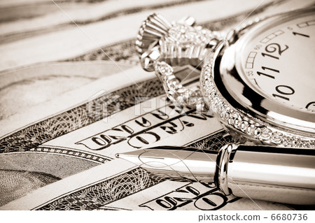 ink pen and watch on dollar banknotes ink pen and watch on dollar banknotes 6680736