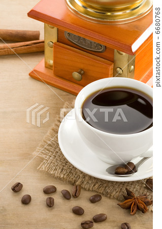 cup of coffee on roasted beans at wooden background 6680768
