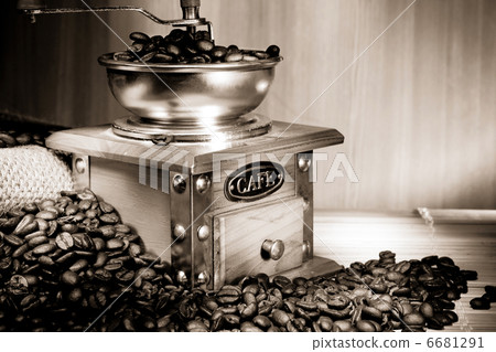 coffee beans and grinder on sacking in sepia 6681291