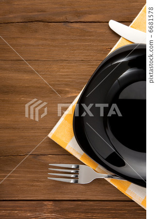 plate, knife and fork on wood 6681578