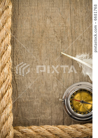 ship ropes and compass on wood 6681768