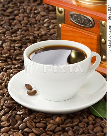 cup of coffee with beans on wood background 6681824