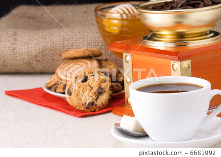 cup of coffee, honey and grinder on sacking 6681992
