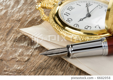 ink pen and watch on wood ink pen and watch on wood 6682058