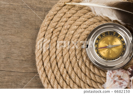 ship ropes and compass on wood 6682150