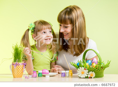 mother with child girl play and paint easter eggs 6687972