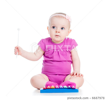 girl baby playing musical toy 6687978