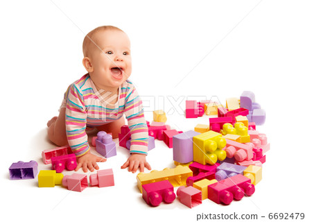baby playing in designer toy blocks 6692479