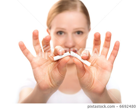 woman breaking cigarette. concept stop smoking woman breaking cigarette. concept stop smoking 6692480