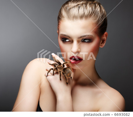 Beautiful Girl Holding Live Tamed Spider in her Hand. Pet Beautiful Girl Holding Live Tamed Spider in her Hand. Pet 6693082