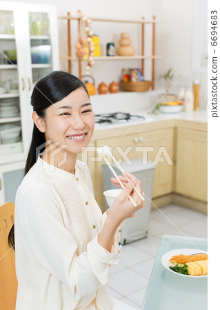 A lady in a meal A lady in a meal 6694683