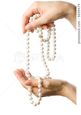 Pearl in woman's hands Pearl in woman's hands 6699474