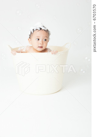 Baby sitting out from the bath 6703570