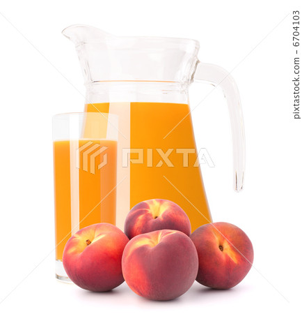 Peach fruit juice in glass jug 6704103