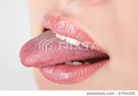 woman sticking her tongues out 6704209