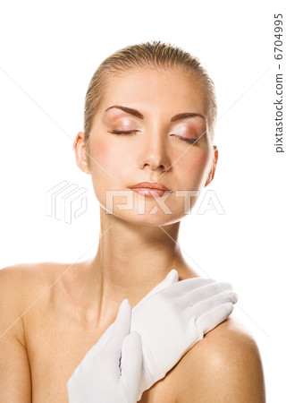 Lovely woman in moisturizing gloves Lovely woman in moisturizing gloves 6704995