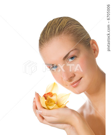 Beautiful girl with yellow orchid isolated on white Beautiful girl with yellow orchid isolated on white 6705006