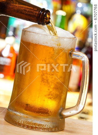 Beer pouring into mug Beer pouring into mug 6707768
