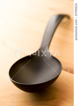 Spoon isolated on wooden background Spoon isolated on wooden background 6709828
