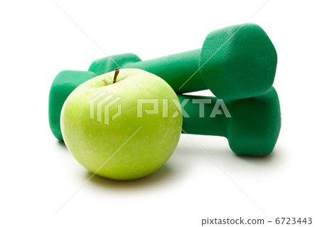 Dumbbells and an apple on white background Dumbbells and an apple on white background 6723443