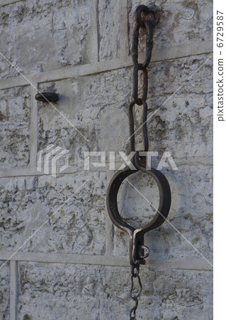 shackles and a chain hanging shackles and a chain hanging 6729587