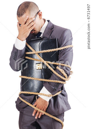 Businessman tied up with rope 6731497