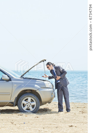 Man with car on seaside Man with car on seaside 6734794