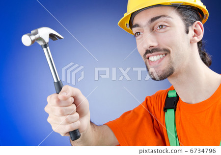 Man with hammer in studio Man with hammer in studio 6734796