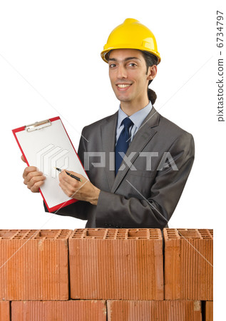 Businessman with bricks on white Businessman with bricks on white 6734797