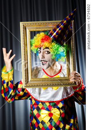 Clown with picture frames in studio Clown with picture frames in studio 6734802