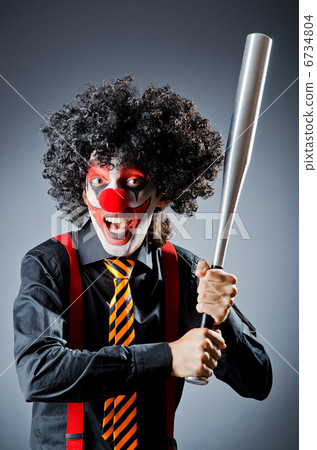 Funny clown with bat in studio Funny clown with bat in studio 6734804