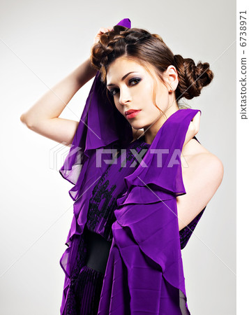 Beautiful fashion woman in purple long dress Beautiful fashion woman in purple long dress 6738971