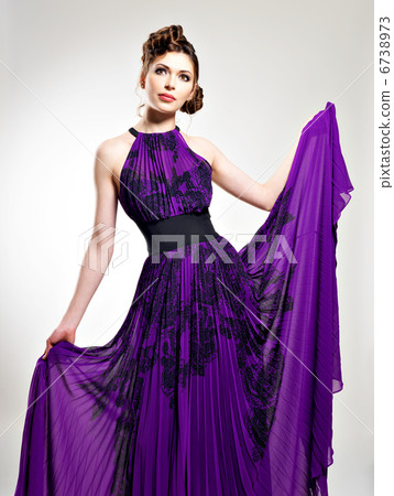 Beautiful fashion woman in purple long dress Beautiful fashion woman in purple long dress 6738973