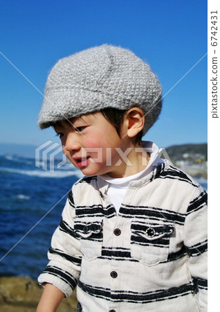 A child walking along the coast A child walking along the coast 6742431