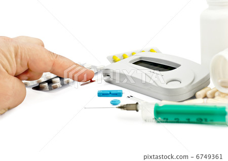 Glucometer with a hand, drugs and a syringe Glucometer with a hand, drugs and a syringe 6749361