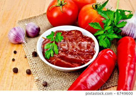 Ketchup with vegetables on a napkin burlap Ketchup with vegetables on a napkin burlap 6749600