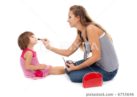 Young mother paints little girl cosmetics Young mother paints little girl cosmetics 6755646