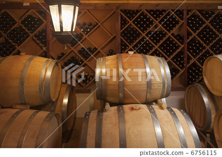 Wine Barrels and Bottles in Cellar Wine Barrels and Bottles in Cellar 6756115