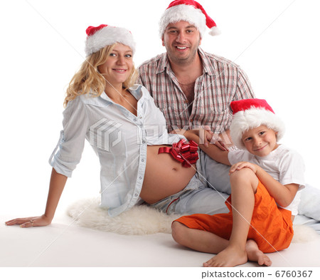Father, son and pregnant mother in christmas hat Father, son and pregnant mother in christmas hat 6760367