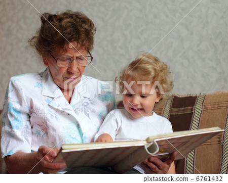 Grandmother reading book to the granddaughter Grandmother reading book to the granddaughter 6761432