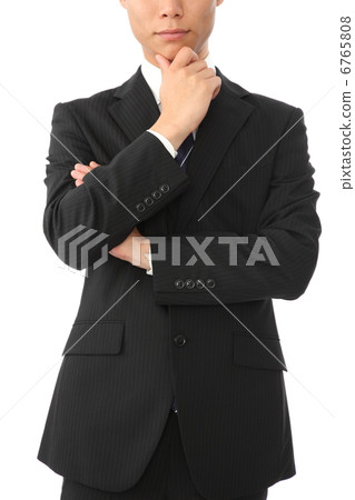 Businessman holding hands on chin 6765808