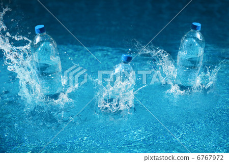 Three bottle of water drop with splash. Shot in motion 6767972